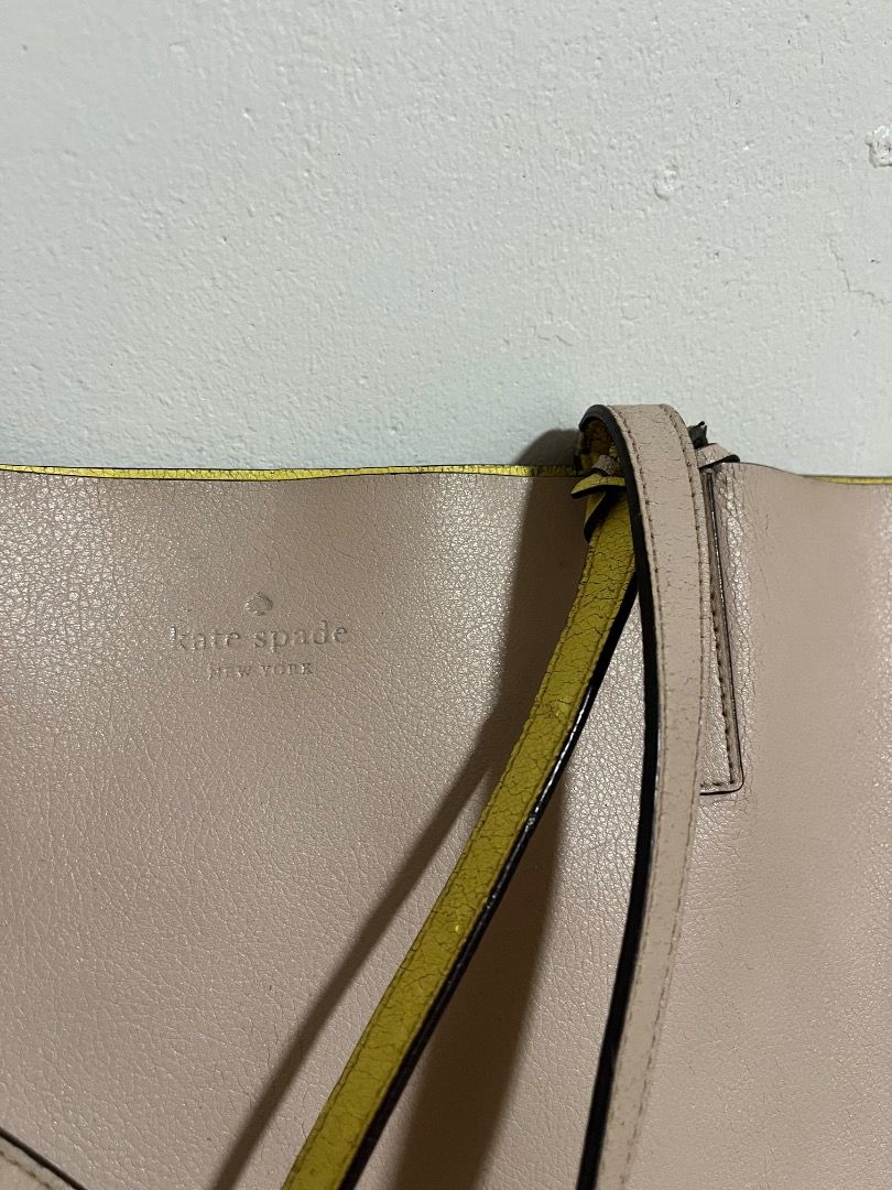 Kate Spade New York Tote Bag (Category: Tote Bags) located in Cabuyao City. Submitted by rdtrmt (Listing ID 1469404875, Image 3). Description: - Brand: Kate Spade (Original) - Pink leather tote bag with a vibrant yellow interior lining - Features double shoulder straps and a debossed silver logo on the front - Roomy everyday carryall style, perfect for daily use - Condition: Some wear on the strap edges but still in good condition.