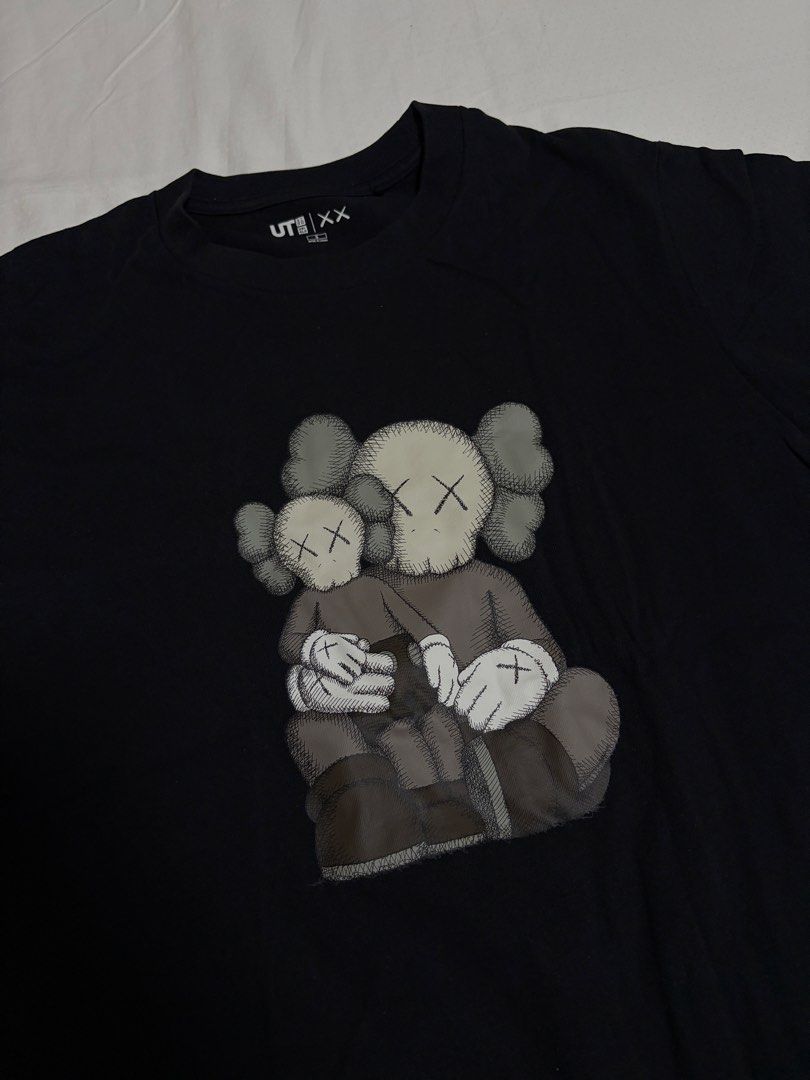 Kaws x Uniqlo Shirt (Category: Tshirts & Polo Shirts ) located in Pasig City. Submitted by chamoisee (Listing ID 1469516244, Image 2). Description: Kaws x Uniqlo Shirt small on tag 18.5”x24”.