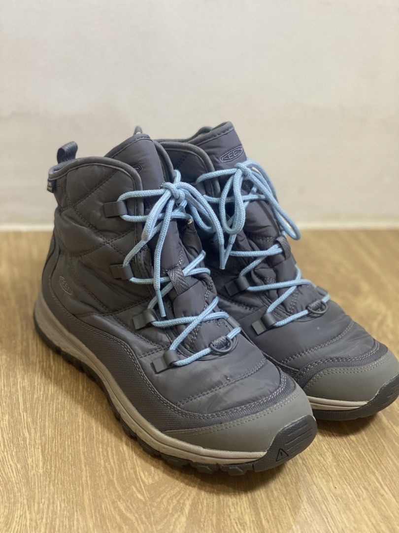 KEEN Grey Winter Boots Size US 9.5 (Category: Boots) located in Manila. Submitted by malongnima87948 (Listing ID 1469503003, Image 1). Description: - Brand: KEEN - Model: 1021736 - Size: US 9.5 / EU 40 - Color: Grey with light blue laces - Lining: Warm faux fur inside - Design: Puffer-style upper with rugged rubber outsole for superior grip - Ideal for: Cold weather, snow, and winter travels.