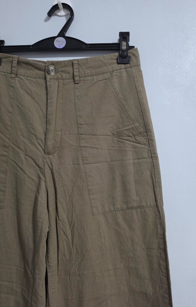 Khaki Cargo Wide Leg Pants (Category: Jeans) located in Paranaque City. Submitted by franinnashop (Listing ID 1469465854, Image 2). Description: Declutter issue last photo - Color: Khaki - Style: Wide leg trousers with trendy side utility pockets - Fit: Fitted waist with back darts, button closure, and zippered front fly - Material: Lightweight and comfortable fabric - Measurements: Waist 26" | Hips 34" | Length 37" | Inseam 26" - Condition/Vibe: