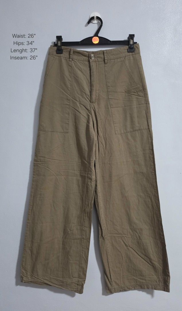 Khaki Cargo Wide Leg Pants (Category: Jeans) located in Paranaque City. Submitted by franinnashop (Listing ID 1469465854, Image 1). Description: Declutter issue last photo - Color: Khaki - Style: Wide leg trousers with trendy side utility pockets - Fit: Fitted waist with back darts, button closure, and zippered front fly - Material: Lightweight and comfortable fabric - Measurements: Waist 26" | Hips 34" | Length 37" | Inseam 26" - Condition/Vibe: