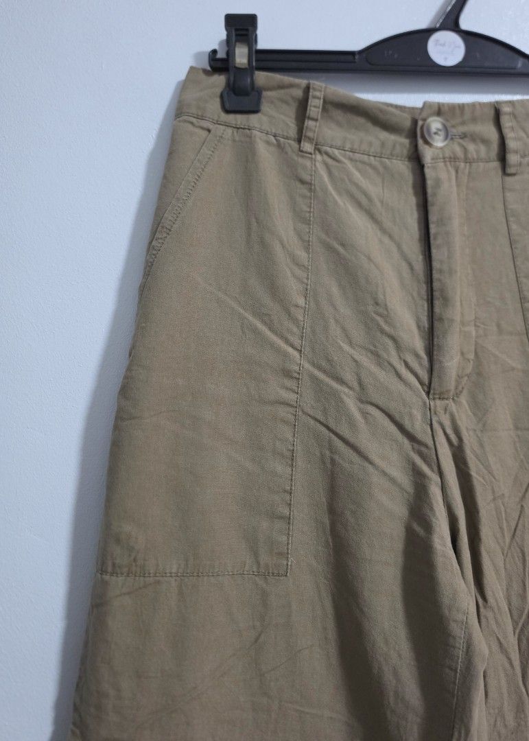 Khaki Cargo Wide Leg Pants (Category: Jeans) located in Paranaque City. Submitted by franinnashop (Listing ID 1469465854, Image 3). Description: Declutter issue last photo - Color: Khaki - Style: Wide leg trousers with trendy side utility pockets - Fit: Fitted waist with back darts, button closure, and zippered front fly - Material: Lightweight and comfortable fabric - Measurements: Waist 26" | Hips 34" | Length 37" | Inseam 26" - Condition/Vibe: