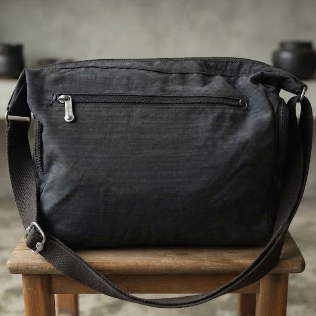 Kipling Grey Crossbody Bag with Multiple Pockets (Category: Cross-body Bags) located in Quezon City. Submitted by eilgaraje (Listing ID 1469509043, Image 2). Description: crossbody bag na super functional at sulit ang presyo, may minor honest flaws man, pero all goods pa rin para sa pang-araw-araw!.