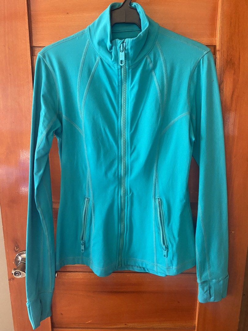 Kirkland Signature Teal Athletic Zip Jacket Medium (Category: Activewear) located in Baguio. Submitted by heath2600 (Listing ID 1469459434, Image 1). Description: - Brand/Style: Kirkland Signature Active Jacket - Color: Bright teal blue - Size: Medium - Material: 87% nylon, 13% spandex (smooth, stretchy athletic fabric) - Features: Full zip front, matching zipper pull, two zippered side pockets - Details: Long sleeves with thumbholes at the cuffs