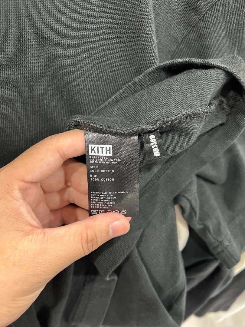 Kith Classic Logo Black T-Shirt (Category: Tshirts & Polo Shirts ) located in Urdaneta. Submitted by jayceegarage (Listing ID 1469545231, Image 3). Description: - Brand: Kith - Color: Black with white box logo graphic - Size: Medium (tag at collar) - Material: 100% cotton (self and rib) - Design: Ribbed crewneck, standard short-sleeve streetwear tee - Details: Item code KH3369, RN 140659, designed in NY / assembled in China - Condition: Fresh and