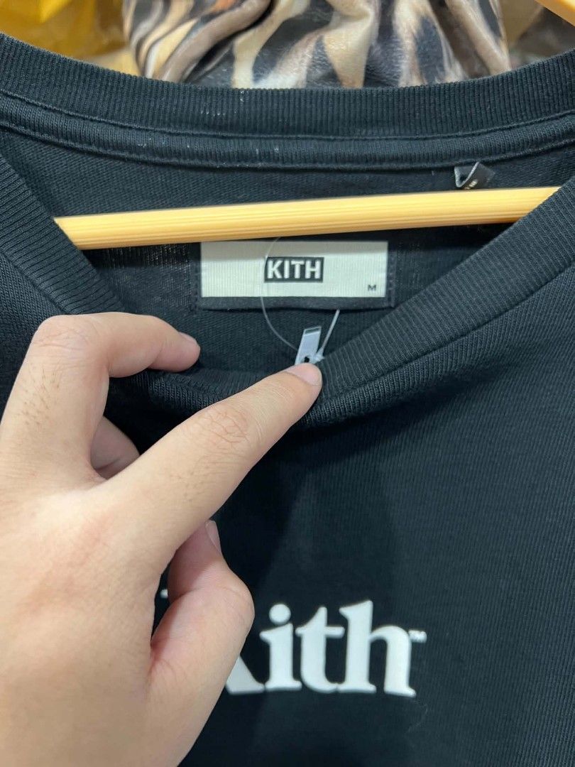 Kith Classic Logo Black T-Shirt (Category: Tshirts & Polo Shirts ) located in Urdaneta. Submitted by jayceegarage (Listing ID 1469545231, Image 2). Description: - Brand: Kith - Color: Black with white box logo graphic - Size: Medium (tag at collar) - Material: 100% cotton (self and rib) - Design: Ribbed crewneck, standard short-sleeve streetwear tee - Details: Item code KH3369, RN 140659, designed in NY / assembled in China - Condition: Fresh and