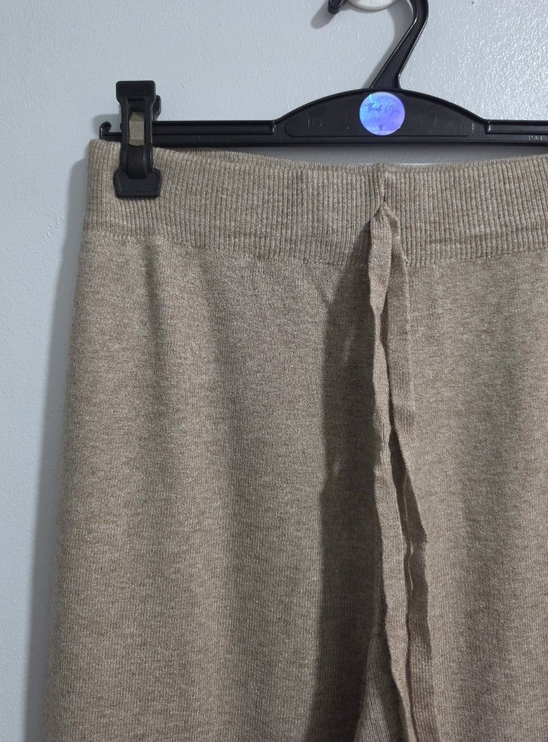 Knitted Wide Leg Pants Beige Drawstring Waist (Category: Jeans) located in Paranaque City. Submitted by franinnashop (Listing ID 1469452390, Image 3). Description: - Color: Beige - Material: Super comfy knit - Fit: High rise, wide leg with elastic waistband and matching drawstring - Measurements: Waist 24-36 inches, Length 38 inches, Inseam 27 inches - Style: Versatile, easy to dress up or keep casual.