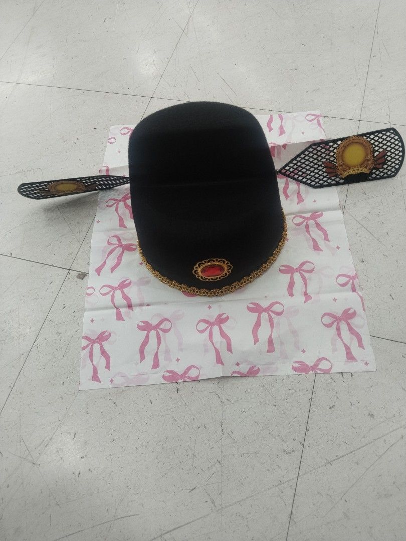 Korean Hat (Category: Caps & Hats) located in Manila. Submitted by zdmal (Listing ID 1469513856, Image 1). Description: - Traditional Chinese official hat design - Features iconic long wing-like flaps on both sides - Elegant gold trim with a striking red faux gem in front - Adorned with decorative gold and yellow medallions on the wings - Sturdy construction that maintains a clean, sharp shape - Ideal for cosplay, drama costumes, and cultural eve