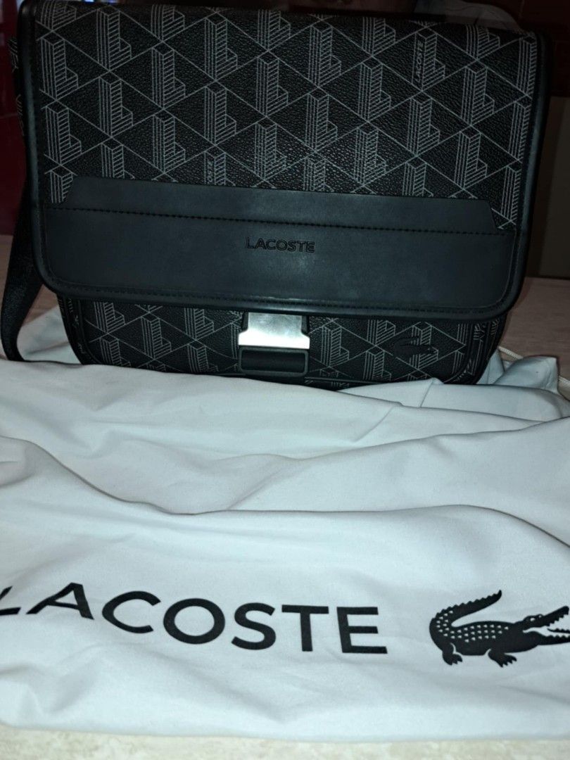 Lacoste - The Blend Flap Close Bag (Category: Luxury Bags & Wallets) located in Makati City. Submitted by awcs101_trading (Listing ID 1469430771, Image 2). Description: NH4411LX model Unisex Bag No box, paperbag, just pouch Price slighlty negotiable RFS: Addtl budget for Iphone.
