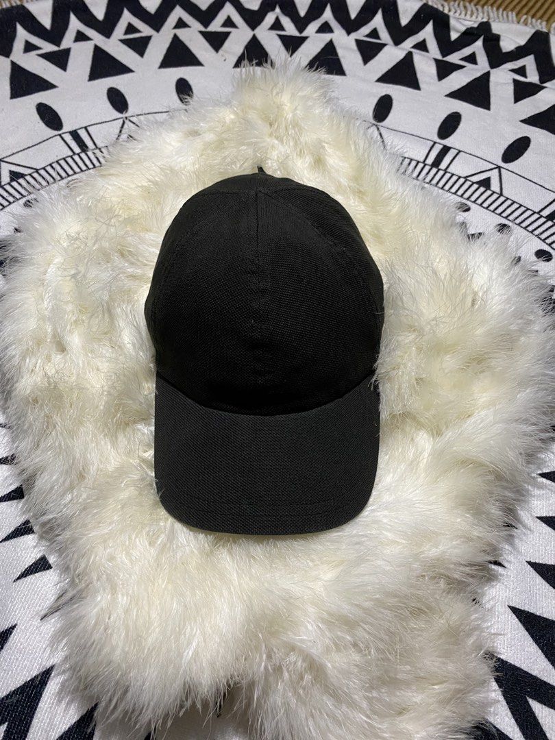 Lacoste Black Cap (Category: Caps & Hats) located in Badiangan. Submitted by iralorana.thrift (Listing ID 1469419329, Image 3). Description: - Brand: Lacoste - Color: Classic Black - Design: Structured with a curved brim - Details: Iconic embroidered green crocodile on the side and Lacoste lettering on the back strap - Fit: Adjustable strap closure for a custom fit - Condition: Clean fabric with minimal signs of wear.