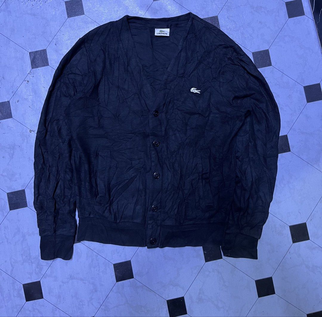 Lacoste Black Cardigan Size 3 (Category: Coats, Jackets and Outerwear) located in Manila. Submitted by ba_thrifted (Listing ID 1469525819, Image 1). Description: Black Lacoste cardigan with button-up front and front pockets. Ribbed cuffs and hem. Size 3 tag on the collar. Embroidered crocodile logo on the chest. Classic v-neck style, lightweight knit material. Great layering piece..