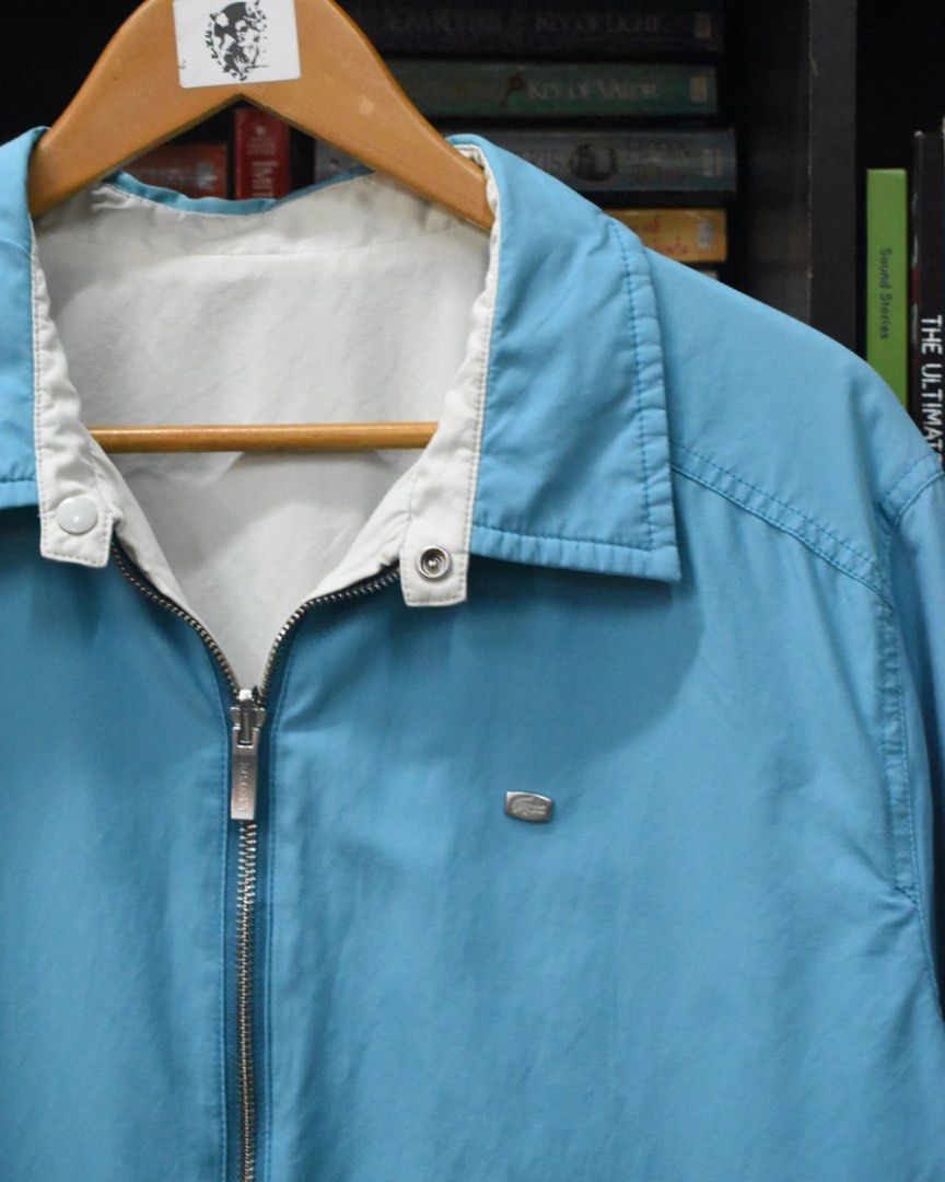 Lacoste Blue/Off White Reversible Harrington type Jacket (Category: Coats, Jackets and Outerwear) located in Baguio. Submitted by marcusmartin2600 (Listing ID 1469436733, Image 3). Description: Size: fits Large Condition: Excellent 📏 Measurement via Tape Measure (in inches): Chest width: 23.5” Length: 29” Shoulders: 19” Sleeve Length: 24.5” Hem: 20” ————————— Note: Please check and ask for detailed photos before buying to avoid cancellations. Al