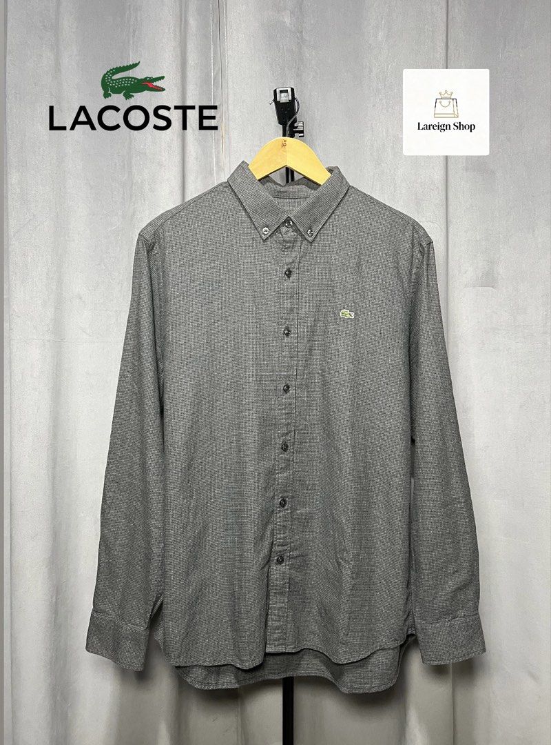 Lacoste Dark Grey Slim Fit Long Sleeve Button-Down (Category: Formal Shirts) located in Luna. Submitted by lareign (Listing ID 1469522008, Image 1). Description: -Color rate: 9.8/10 -Issue: None -Overall: Excellent Condition -perfect for formal and smart casual outfits.