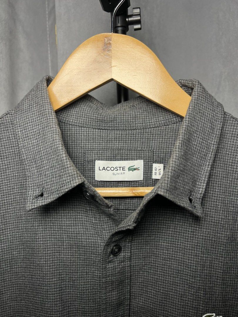 Lacoste Dark Grey Slim Fit Long Sleeve Button-Down (Category: Formal Shirts) located in Luna. Submitted by lareign (Listing ID 1469522008, Image 3). Description: -Color rate: 9.8/10 -Issue: None -Overall: Excellent Condition -perfect for formal and smart casual outfits.