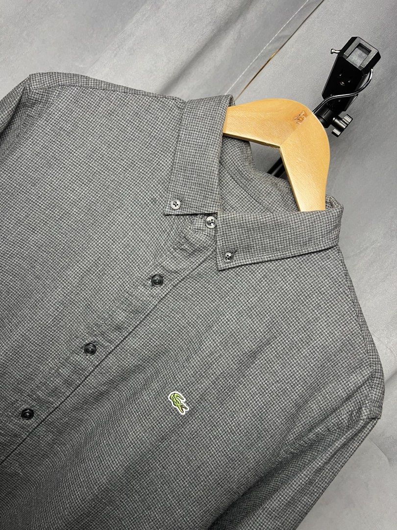 Lacoste Dark Grey Slim Fit Long Sleeve Button-Down (Category: Formal Shirts) located in Luna. Submitted by lareign (Listing ID 1469522008, Image 2). Description: -Color rate: 9.8/10 -Issue: None -Overall: Excellent Condition -perfect for formal and smart casual outfits.