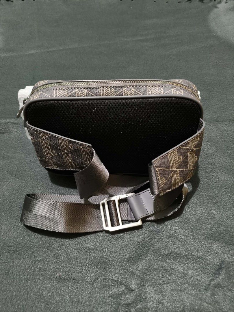 Lacoste Monogram Bag (Category: Belt bags, Clutches and Pouches) located in Quezon City. Submitted by leilumiereclassique (Listing ID 1469412741, Image 2). Description: - Authentic Lacoste crossbody bag - Stylish grey and brown monogram geometric pattern - Solid grey top flap with debossed branding - Adjustable strap and breathable mesh back panel - Compact size, perfect for daily essentials - Clean hardware with smoothly working zippers.