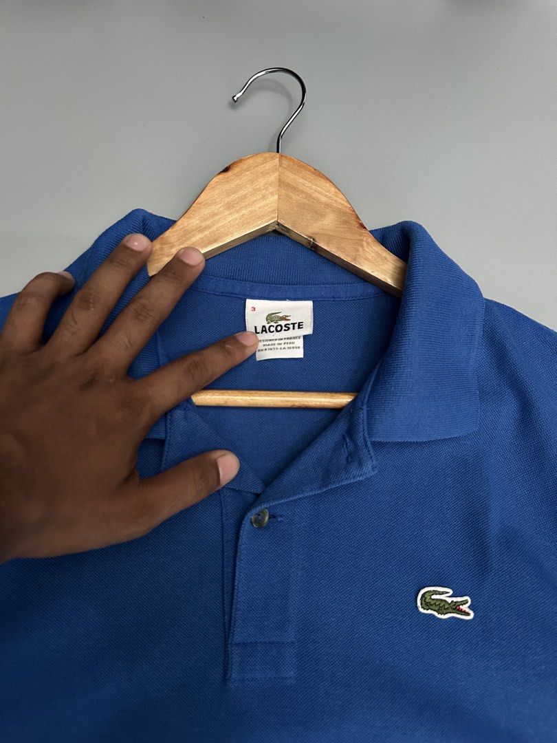 Lacoste Polo Shirt (Category: Activewear) located in Manila. Submitted by thriftavenueph (Listing ID 1469428343, Image 2). Description: Fs: Lacoste Polo Shirt Size: 22x30, L Condition: excellent, 10/10 color, have a minimal stain need wash only Price: 950.