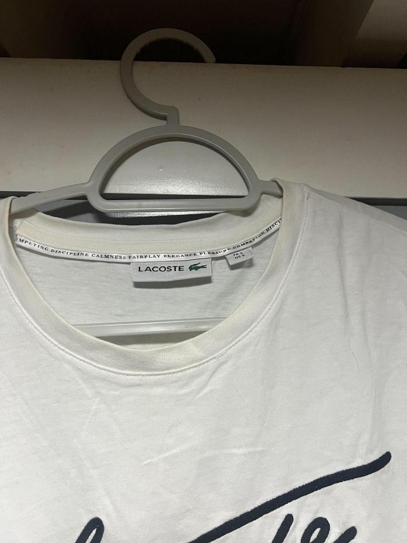 Lacoste Shirt (Category: Tshirts & Polo Shirts ) located in Mandaluyong City. Submitted by santideclutters (Listing ID 1469526560, Image 2). Description: size: 25L 19W (S) color rate: 9.5/10 condition: 9/10 needs washing COLOR MAY VARY DUE TO LIGHTING.