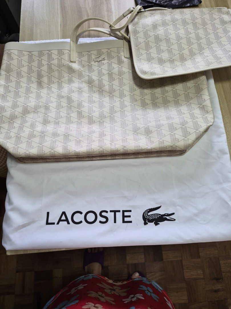 Lacoste Tote Bag NF4344ZE with Pouch (Category: Tote Bags) located in Manila. Submitted by freestone_f18729 (Listing ID 1469569938, Image 1). Description: - Color/Pattern: White with all-over geometric monogram print - Includes: Matching zippered pouch and white dust bag - Design: Double shoulder handles, open top interior, unlined canvas fabric - Origin: Made in Cambodia - Style Code: S2625 PK NF4344ZE - Condition: Brand new and well-maintained 
