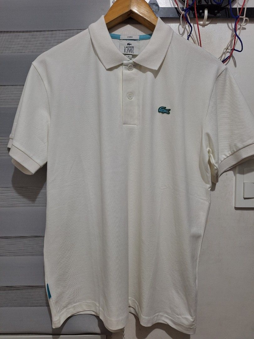 Lacoste white polo blue logo (Category: Tshirts & Polo Shirts ) located in Muntinlupa City. Submitted by kstefanomela14 (Listing ID 1469542835, Image 1). Description: brandnew unused poloshirt pure white medium - 20.5 x 26.5 cod cop lalamove j&t Lbc.