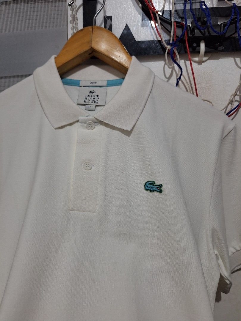 Lacoste white polo blue logo (Category: Tshirts & Polo Shirts ) located in Muntinlupa City. Submitted by kstefanomela14 (Listing ID 1469542835, Image 2). Description: brandnew unused poloshirt pure white medium - 20.5 x 26.5 cod cop lalamove j&t Lbc.