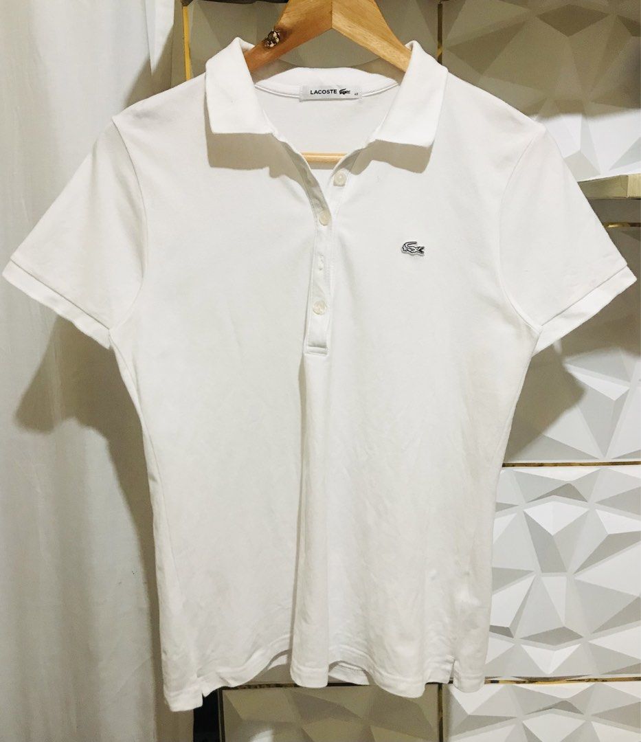Lacoste White Polo Shirt Size 40 Devanlay (Category: Luxury Apparel) located in Rizal. Submitted by drthriftfour (Listing ID 1469572536, Image 1). Description: - Authentic Lacoste polo shirt in crisp white - Size 40 with Devanlay manufacturing tag - Classic cotton pique fabric with ribbed collar and short sleeves - Premium mother-of-pearl branded buttons - Iconic embroidered green crocodile logo on the chest - Clean neckline and excellent everyda