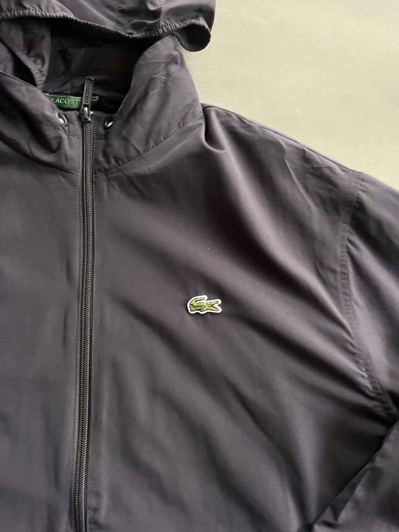 Lacoste windbreaker (Category: Coats, Jackets and Outerwear) located in Manila. Submitted by lardo.599 (Listing ID 1469482752, Image 2). Description: Size M to L No issue Packable Color rate 10/10.