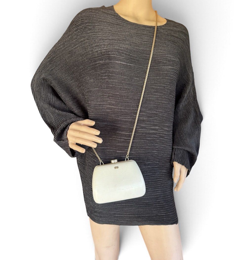 Lancel Paris White Crocodile Embossed Clutch Bag (Category: Clutches) located in Lingayen. Submitted by lux_thrift (Listing ID 1469442818, Image 1). Description: location pangasinan hard shell clutch perfect for wedding and formal events very minor signs of use only promax phones cannot fit no inclusion .