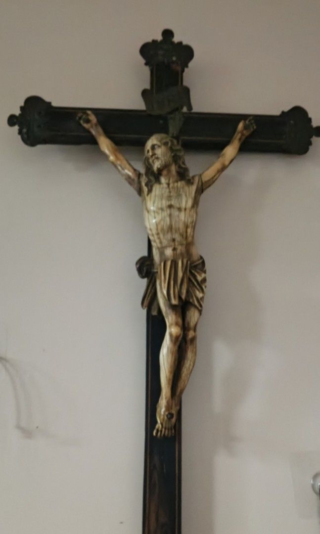 HISPANO - PHILIPINE IVORY CRUCIFIX (Category: Religious Items) located in Cagayan de Oro. Submitted by humandignityadvocate (Listing ID 1469567568, Image 1). Description: - Large wooden crucifix featuring a rich dark finish and elegant gold trim lines - Detailed ivory carved corpus sculpture with visible grain texture, traditional crown of thorns, and drapery - Includes a metal INRI plaque mounted above the figure and an ornate decorative crest o