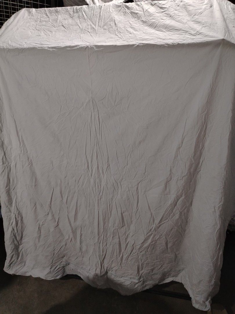 Large grey crinkled textured fabric material sheet drape (Category: Bedding & Towels) located in Manila. Submitted by mimachelleukay (Listing ID 1469519217, Image 3). Description: - Large dark grey fabric with a heavy crinkled texture - Heavy drape style, perfect for furniture covers or backdrops - Creased surface design that covers a wide area - Easy to fold and store when not in use.