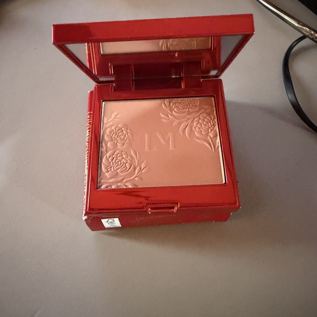 Laura Mercier Blush Color Infusion Ginger (Category: Makeup) located in Bulacan. Submitted by gomdosuns.1 (Listing ID 1469453487, Image 2). Description: - Brand: Laura Mercier - Product: Blush Color Infusion - Shade: Ginger - Edition: Limited edition red and gold peony packaging - Size: Net weight 6g - Features: Built-in mirror inside the compact case - Inclusions: Comes with original outer box - Condition: Brand new / Authentic - Expiration: 02/
