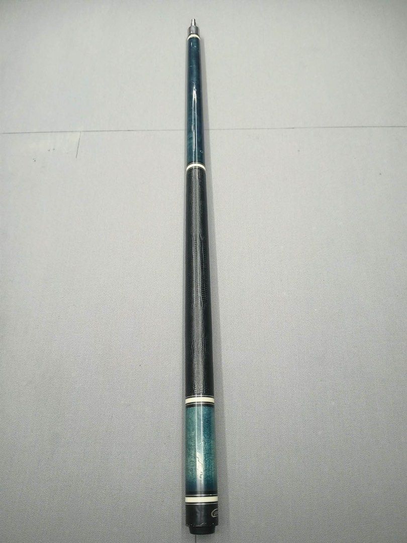 Leadsuper Pool Cue Blue Wood Grain Finish (Category: Billiards and Bowling) located in Mandaluyong City. Submitted by rga555 (Listing ID 1469500691, Image 1). Description: - Brand: Leadsuper - Design: Striking blue wood grain forearm with matching blue sleeve and white accent rings - Grip: Black faux-lizard wrap for a solid, comfortable hold - Joint: Metallic pin joint - Details: Standard two-piece butt section with silver Leadsuper branding plat