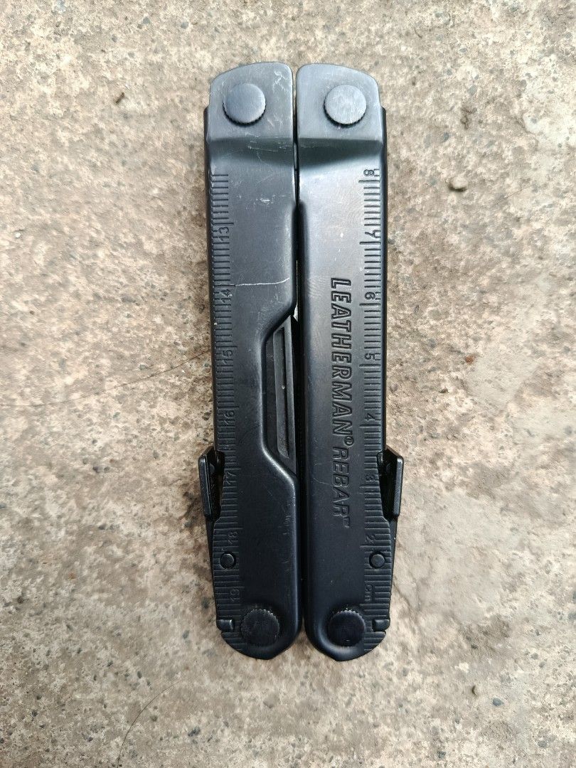 Leatherman Rebar Black Multi-Tool (Category: Construction Tools & Equipment) located in Valenzuela. Submitted by wildstar.015060 (Listing ID 1469460767, Image 2). Description: Leatherman Rebar multi-tool in black finish. Includes needlenose pliers, regular pliers, wire cutters, knife blades, wood saw, file, screwdrivers, and bottle opener. Built entirely in stainless steel. Heavy-duty construction with integrated rulers on the handles. All tools 