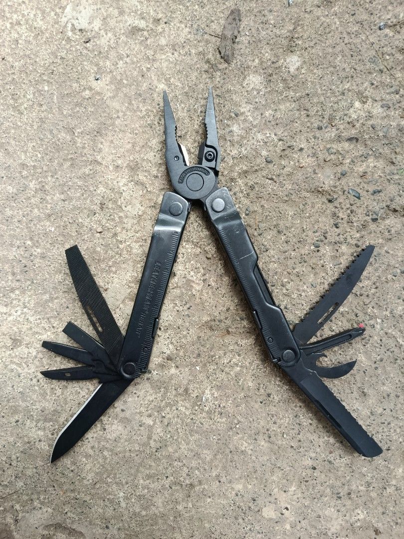 Leatherman Rebar Black Multi-Tool (Category: Construction Tools & Equipment) located in Valenzuela. Submitted by wildstar.015060 (Listing ID 1469460767, Image 3). Description: Leatherman Rebar multi-tool in black finish. Includes needlenose pliers, regular pliers, wire cutters, knife blades, wood saw, file, screwdrivers, and bottle opener. Built entirely in stainless steel. Heavy-duty construction with integrated rulers on the handles. All tools 