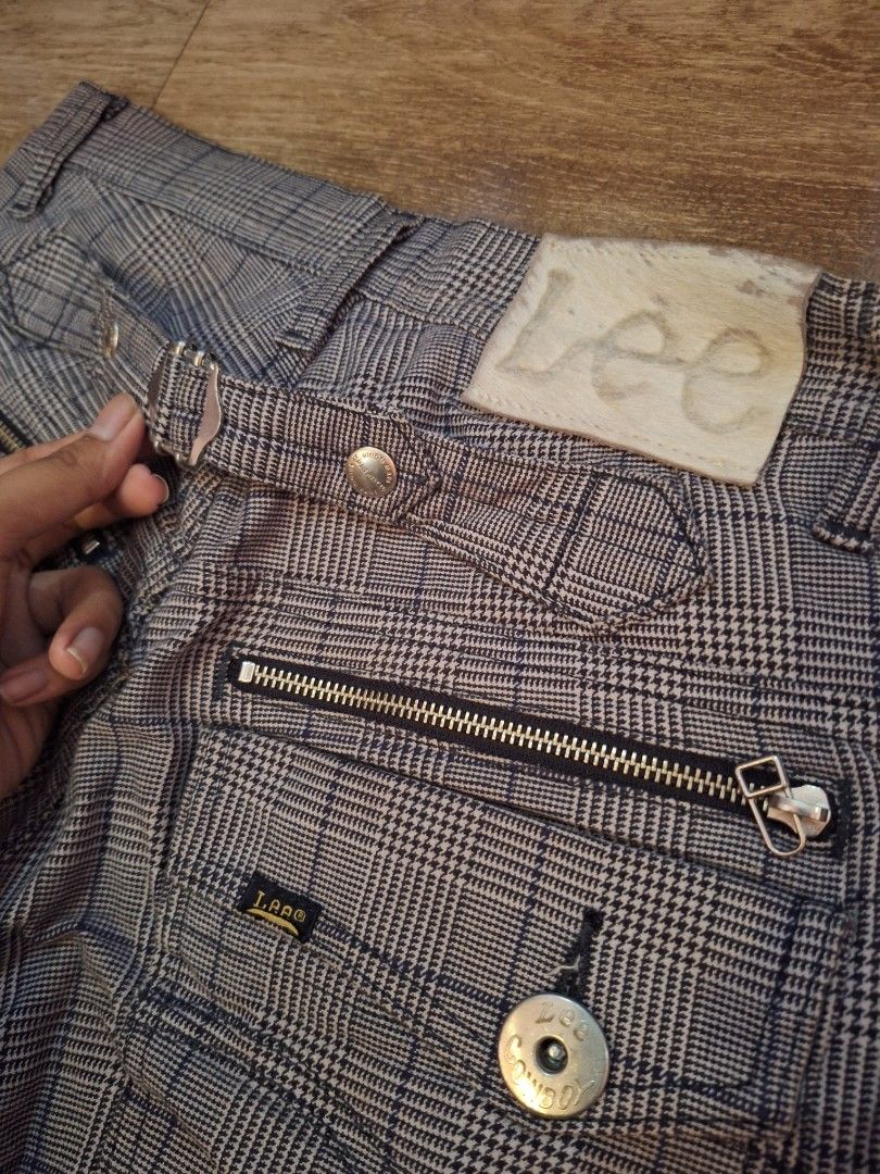 Lee Cowboy Plaid Distressed Cargo Pants Size 30 (Category: Jeans) located in Balamban. Submitted by ubethan (Listing ID 1469459655, Image 2). Description: Waist: 30 in" Length: 35 in" - Brand/Model: Lee Cowboy Cargo Pants - Size: 30 - Color/Pattern: Grey Plaid - Details: Heavy shredding at knees, multiple zippered and side cargo pockets - Fit: Adjustable waist tabs with buckle hardware and unique split hem at the ankles - Style: Grunge / Punk aes