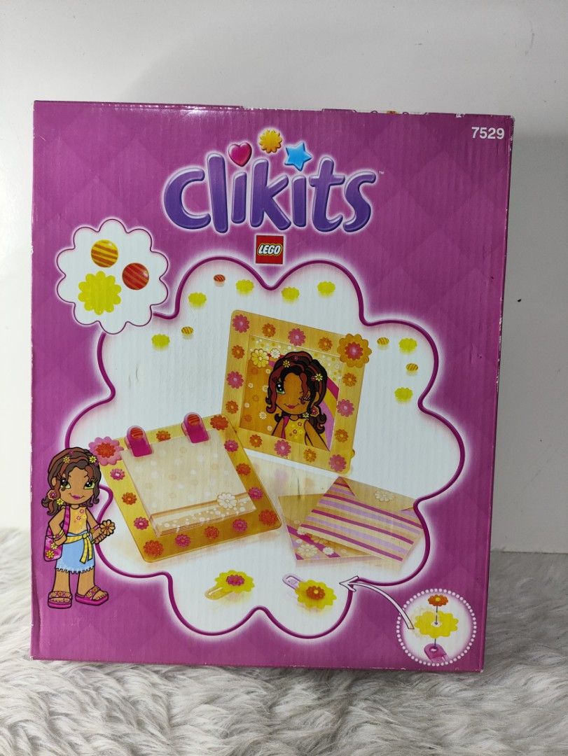 LEGO Clikits 7529 Creative Design Set (Category: Lego & Building Sets) located in Cavite. Submitted by tinetaclesss (Listing ID 1469508876, Image 1). Description: - Rare vintage LEGO Clikits set (Number 7529) - Features early 2000s craft accessories, envelopes, and yellow picture frames - Comes in original purple packaging with classic cartoon character artwork - Great collectible piece for retro LEGO fans - Original box is intact and well-preser