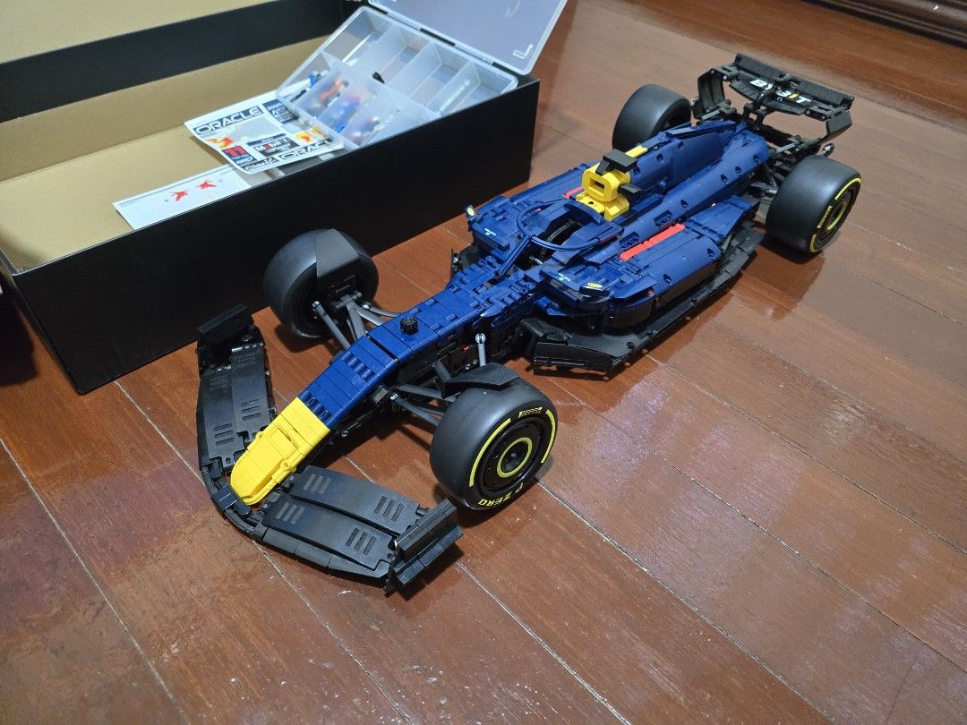 LEGO Technic Oracle Red Bull Racing RB18 Car (Category: Lego & Building Sets) located in Manila. Submitted by anton815 (Listing ID 1469451048, Image 3). Description: -Rastar 1:8 Red Bull -Licensed F1 building blocks Counterpart of lego technic -Built and displayed -Originally Php 8,999 -Complete parts, no broken or glued parts -Some stickers placed -1 step in building the spoiler was missed but can figured out in the manual however I have no time