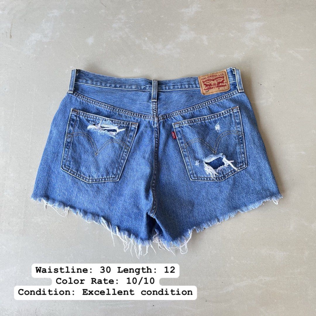 Levi's 501 Distressed Denim Shorts Size 30 (Category: Shorts) located in Mandaue City. Submitted by chinsyap_03 (Listing ID 1469467726, Image 1). Description: - Brand: Levi's 501 - Wash: Medium blue with heavy distressing and rips - Details: Button fly, branded hardware, signature leather back patch, and raw frayed hem - Measurements: Waist 30 inches, Length 12 inches - Condition: Excellent pre-loved condition - Mode of Payment: GCash or BPI - Sh