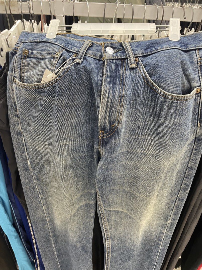 Levi's Blue Denim Jeans (Category: Jeans) located in Cainta. Submitted by mariss.luxx (Listing ID 1469466743, Image 3). Description: - Brand: Levi's - Color/Wash: Classic blue with vintage wash - Fit: Straight leg - Style: Traditional 5-pocket design with button closure - Details: Signature red tab, printed pocket lining, and contrast stitching - Condition: Great everyday casual staple.