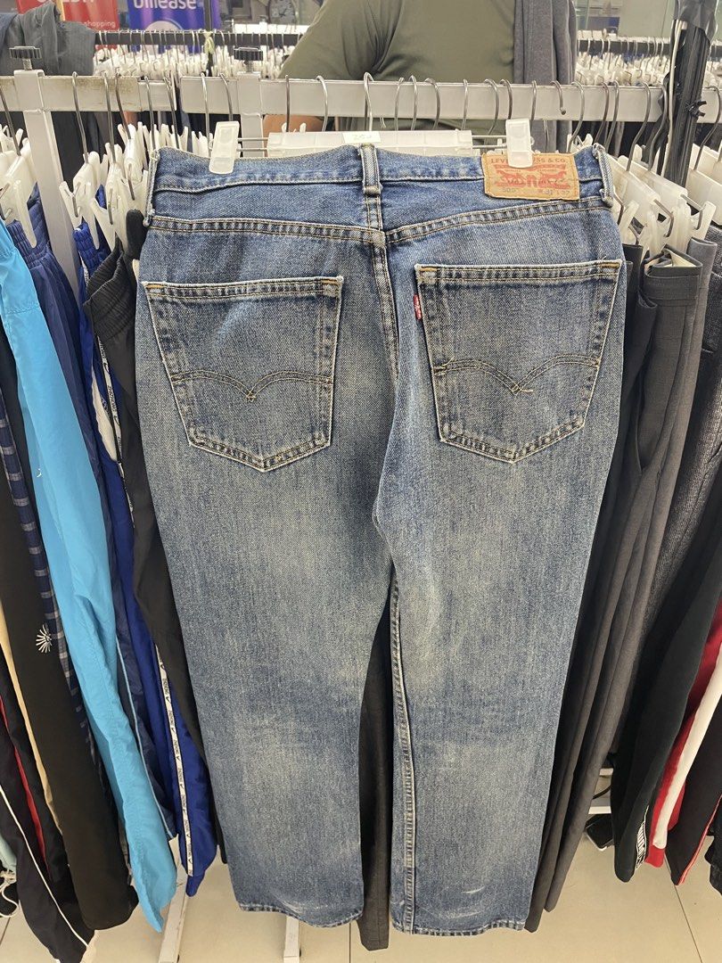 Levi's Blue Denim Jeans (Category: Jeans) located in Cainta. Submitted by mariss.luxx (Listing ID 1469466743, Image 2). Description: - Brand: Levi's - Color/Wash: Classic blue with vintage wash - Fit: Straight leg - Style: Traditional 5-pocket design with button closure - Details: Signature red tab, printed pocket lining, and contrast stitching - Condition: Great everyday casual staple.