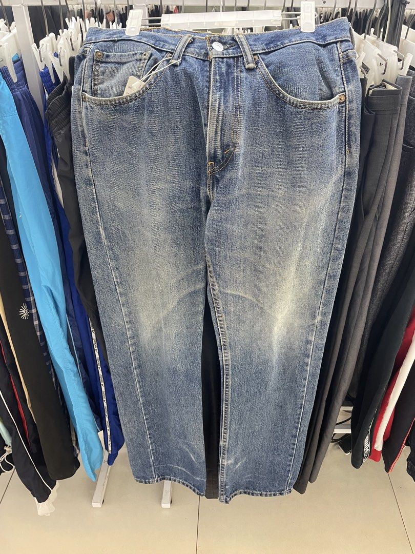 Levi's Blue Denim Jeans (Category: Jeans) located in Cainta. Submitted by mariss.luxx (Listing ID 1469466743, Image 1). Description: - Brand: Levi's - Color/Wash: Classic blue with vintage wash - Fit: Straight leg - Style: Traditional 5-pocket design with button closure - Details: Signature red tab, printed pocket lining, and contrast stitching - Condition: Great everyday casual staple.