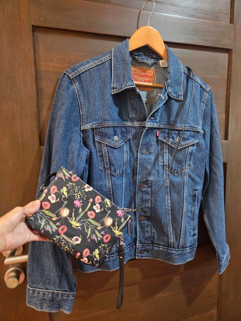 Levi's denim jacket size S (Category: Coats, Jackets and Outerwear) located in Manila. Submitted by mysticrabbit.284012 (Listing ID 1469480052, Image 1). Description: - Brand: Levi's - Style: Classic denim jacket - Color/Wash: Dark blue - Size: S - Details: Front button closure, branded metal hardware, two chest flap pockets, two side pockets - Branding: Red Levi's tab on chest pocket, tan leather patch on back collar - Origin: Made in Bangladesh
