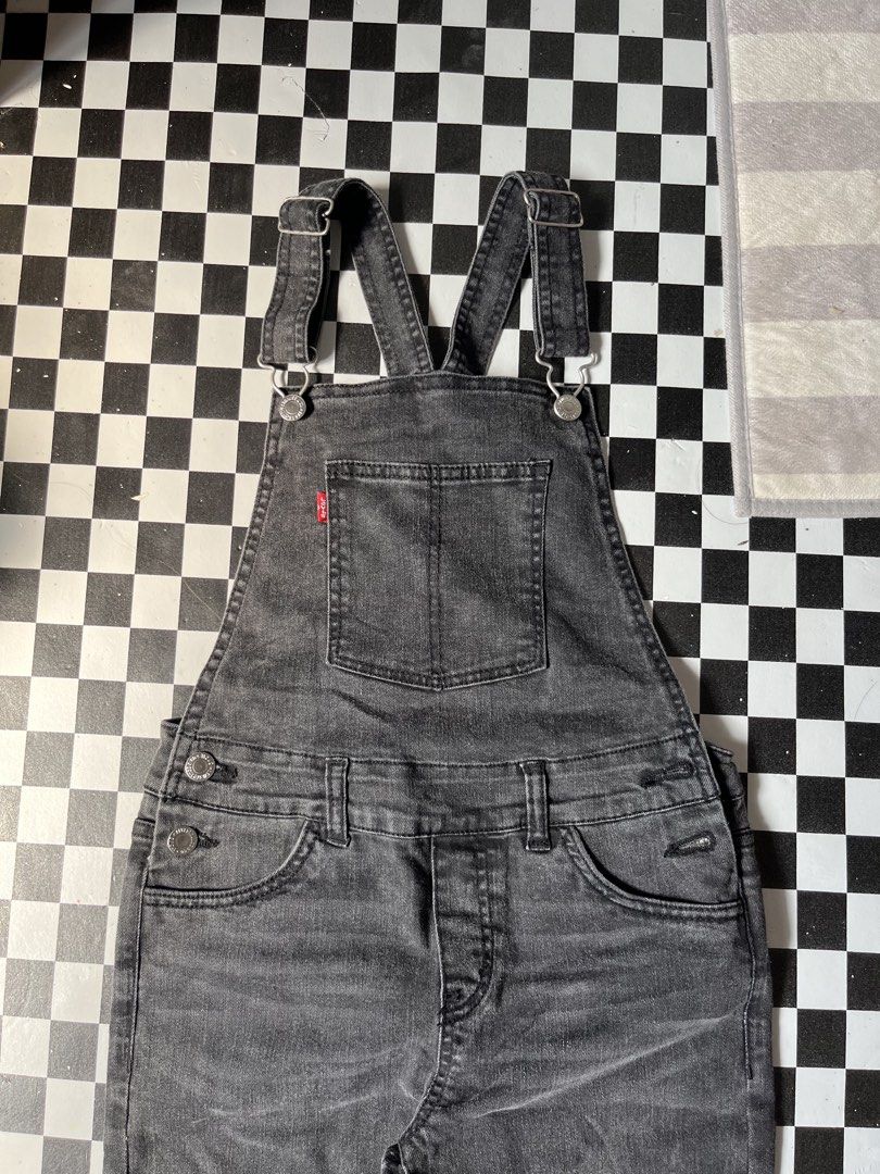 Levi's Denim Overalls Black Wash (Category: Jumpsuits) located in Manila. Submitted by thrifttika (Listing ID 1469446102, Image 3). Description: - Brand: Levi's - Style: Acid wash black denim overalls - Hardware: Silver-tone metal - Features: Adjustable shoulder straps, classic bib pocket with red tab, front and back pockets, and belt loops - Material: Durable, high-quality denim with a faded finish - Mode of Payment: GCash, BPI, or COD via suppo