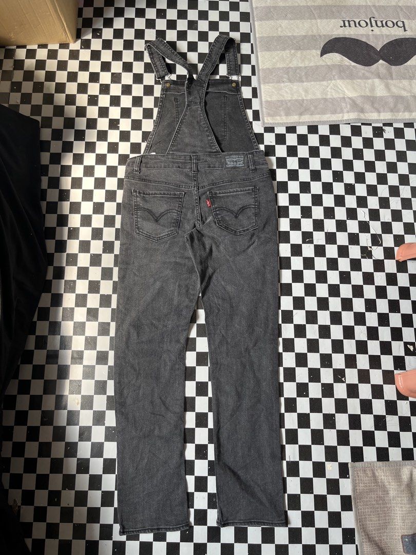 Levi's Denim Overalls Black Wash (Category: Jumpsuits) located in Manila. Submitted by thrifttika (Listing ID 1469446102, Image 2). Description: - Brand: Levi's - Style: Acid wash black denim overalls - Hardware: Silver-tone metal - Features: Adjustable shoulder straps, classic bib pocket with red tab, front and back pockets, and belt loops - Material: Durable, high-quality denim with a faded finish - Mode of Payment: GCash, BPI, or COD via suppo