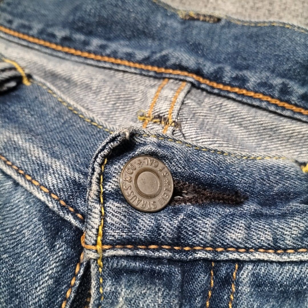 Levi's Made In Japan Jeans (Category: Jeans) located in Taytay. Submitted by calmtree-6248 (Listing ID 1469536092, Image 2). Description: - Authentic Levi's denim jeans crafted in Japan - Medium wash blue featuring stylish whiskering and fading - Classic 5-pocket styling with a secure button fly - Branded hardware and smooth functionality - Unique pocket lining with special 'Made in Japan' text and graphic prints - Interior tags include global co