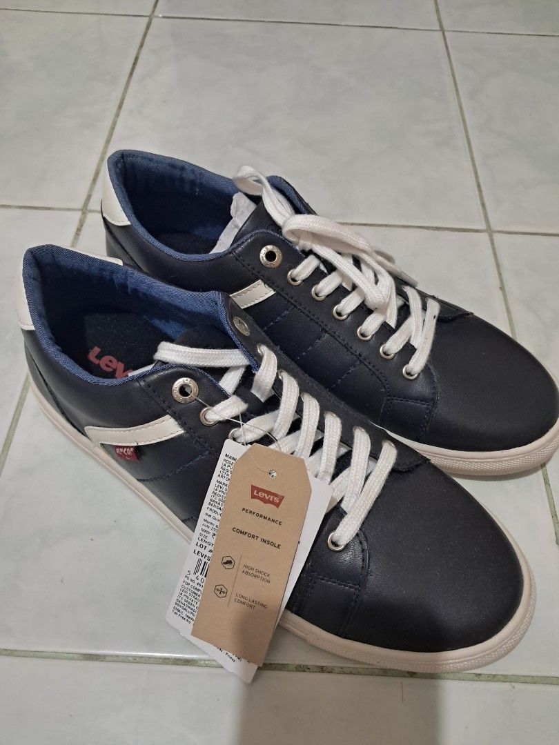 Levi's Navy Blue Casual Sneakers (Category: Casual Shoes) located in Lucena. Submitted by wisebear.f1e959 (Listing ID 1469445036, Image 2). Description: - Brand: Levi's - Color: Navy blue with white laces and rubber soles - Features: Iconic red Levi's brand tab on the side, blue inner lining, and white heel accent - Condition: Excellent, clean everyday footwear - Style: Casual sneakers perfect for daily outfits.