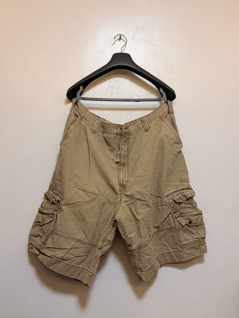 Levi's Squad Cargo Shorts W40 Khaki (Category: Shorts) located in Manila. Submitted by swiftgem.eeb06e (Listing ID 1469515498, Image 1). Description: - Brand: Levi's (Squad Cargo Shorts) - Size: W40 - Color: Khaki - Material: 100% Cotton - Features: Multiple side and back pockets, button closure, standard belt loops, branded metal button, and classic Levi's red tab - Condition/Origin: Great everyday warm weather staple, Made in China - Size: 40 -