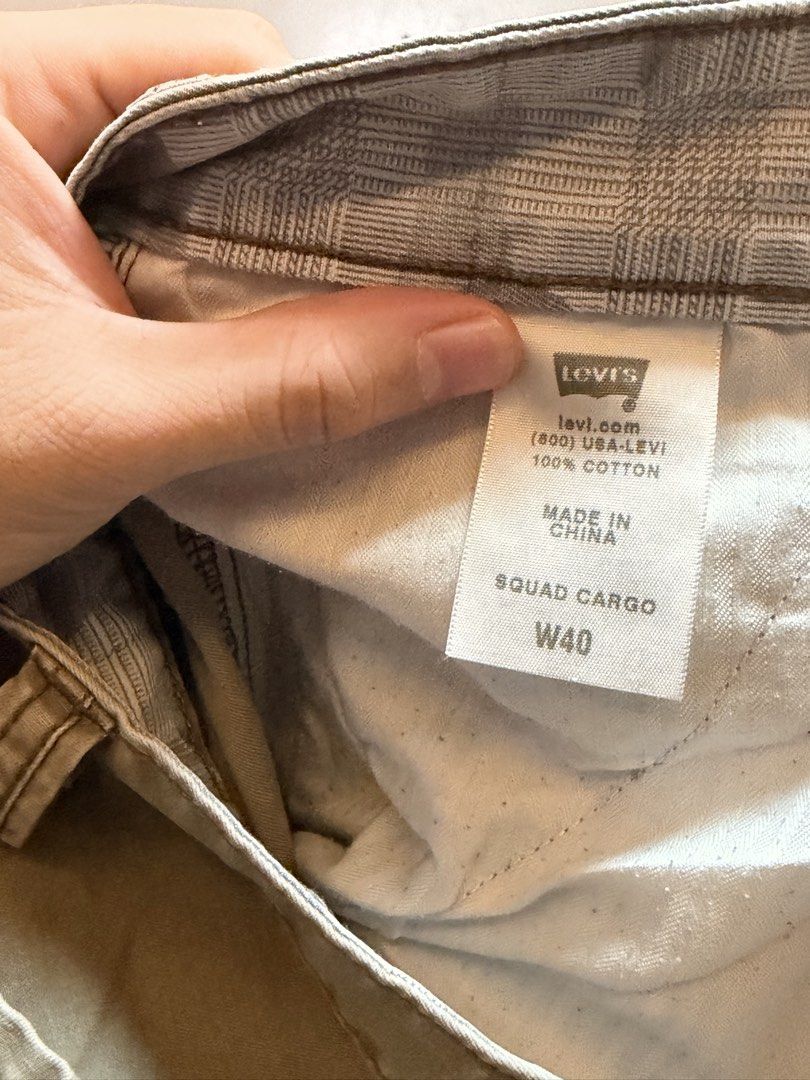 Levi's Squad Cargo Shorts W40 Khaki (Category: Shorts) located in Manila. Submitted by swiftgem.eeb06e (Listing ID 1469515498, Image 3). Description: - Brand: Levi's (Squad Cargo Shorts) - Size: W40 - Color: Khaki - Material: 100% Cotton - Features: Multiple side and back pockets, button closure, standard belt loops, branded metal button, and classic Levi's red tab - Condition/Origin: Great everyday warm weather staple, Made in China - Size: 40 -