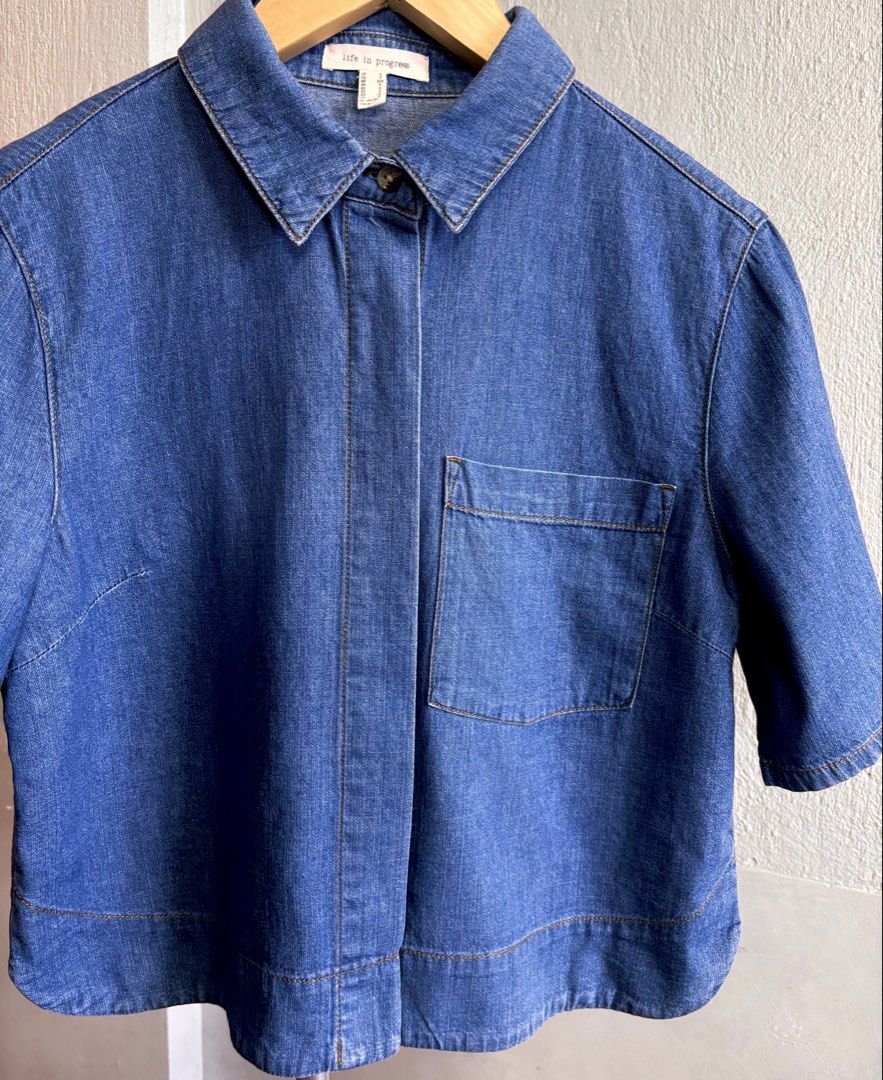Life in Progress Denim Short Sleeve Button Up Shirt (Category: Shirts) located in Las Pinas. Submitted by tienda_ (Listing ID 1469403258, Image 2). Description: Life in Progress (H&M) Style: Blue denim short sleeve shirt Closure: Button-up with hidden placket Details: Left chest pocket, classic collar, and stylish hem stitching .
