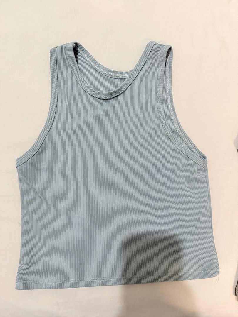 Light blue ribbed cropped tank top (Category: Sleeveless) located in Paranaque City. Submitted by hannahking36 (Listing ID 1469535084, Image 1). Description: - Color: Light blue - Style: Sleeveless racerback, cropped length - Material: Soft and stretchy ribbed knit fabric - Versatility: Perfect basic piece for everyday outfits, easy to pair with shorts, jeans, or skirts - Condition: Clean inside and out, excellent pre-loved condition.